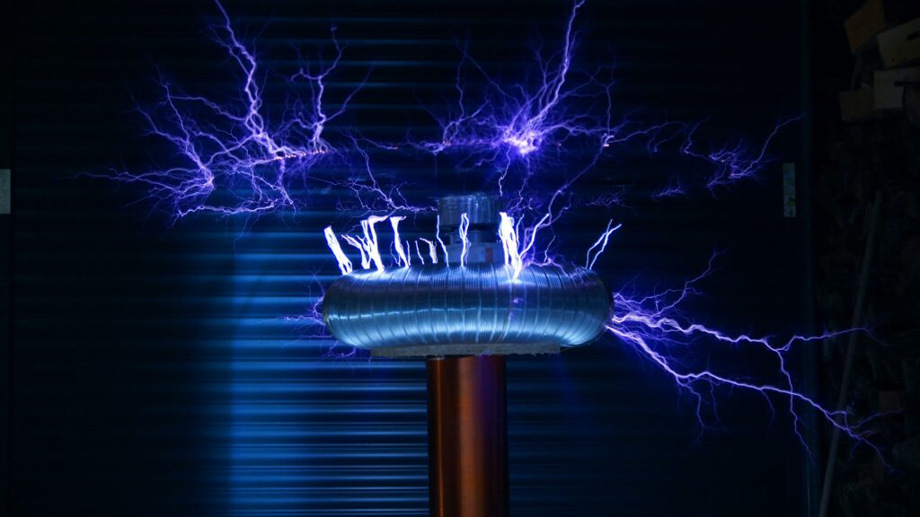 A Tesla coil producing powerful electric arcs in a dark setting.