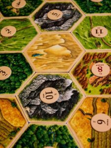 board game, settlers of catan, game, pieces, table, numbers, hexagon, shape, competition, strategy, play, intelligence, entertainment, challenge, leisure, dice, history, table game, board game, board game, board game, board game, board game, settlers of catan, hexagon, hexagon
