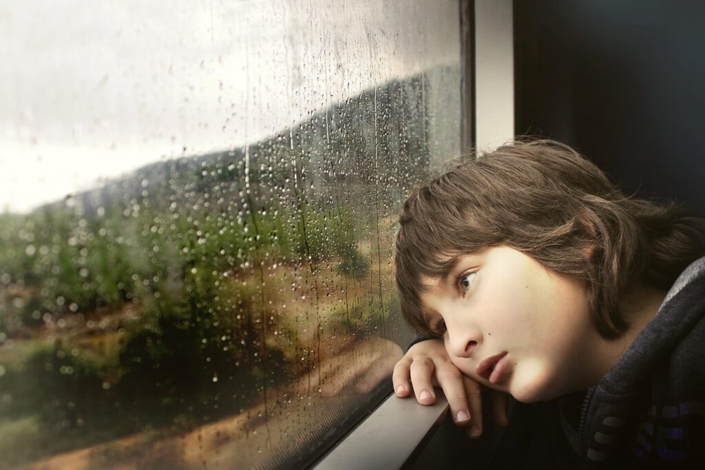 little boy, nature, window, waiting, bored, tired, rainy weather, glass window, raindrops, water droplets, wet, kid, child, inside, train, looking out, boring, travel, rain, weather, water, droplets, sad
